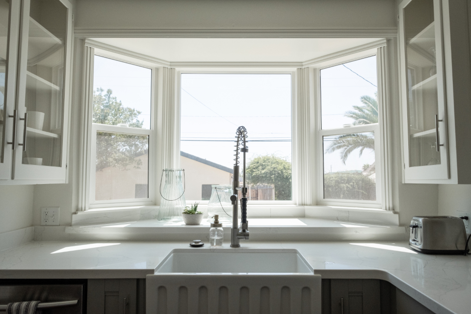 Bright modern kitchen with a bay window during a home tour