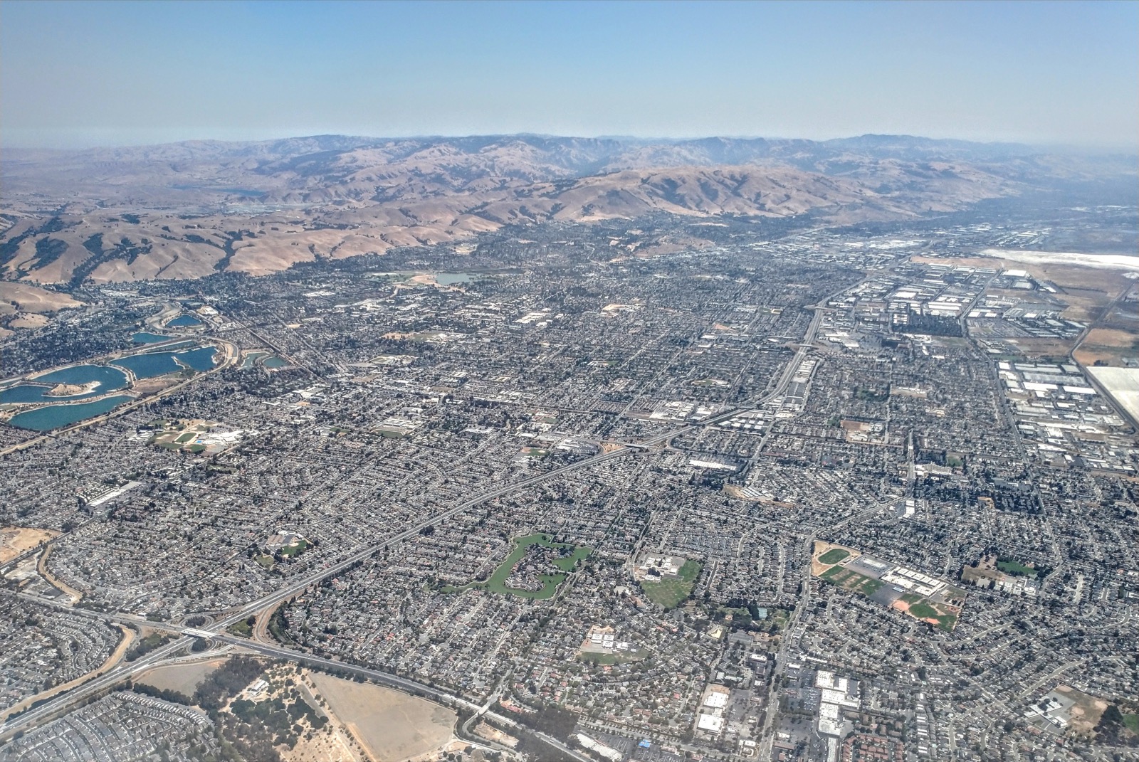 Aerial view of Fremont, California residential neighborhoods and the East Bay hills