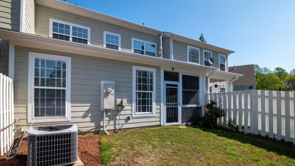 Modern gray house exterior with clean siding and white trim