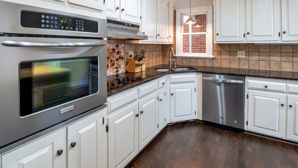 Bright kitchen with white cabinet fronts and stainless appliances