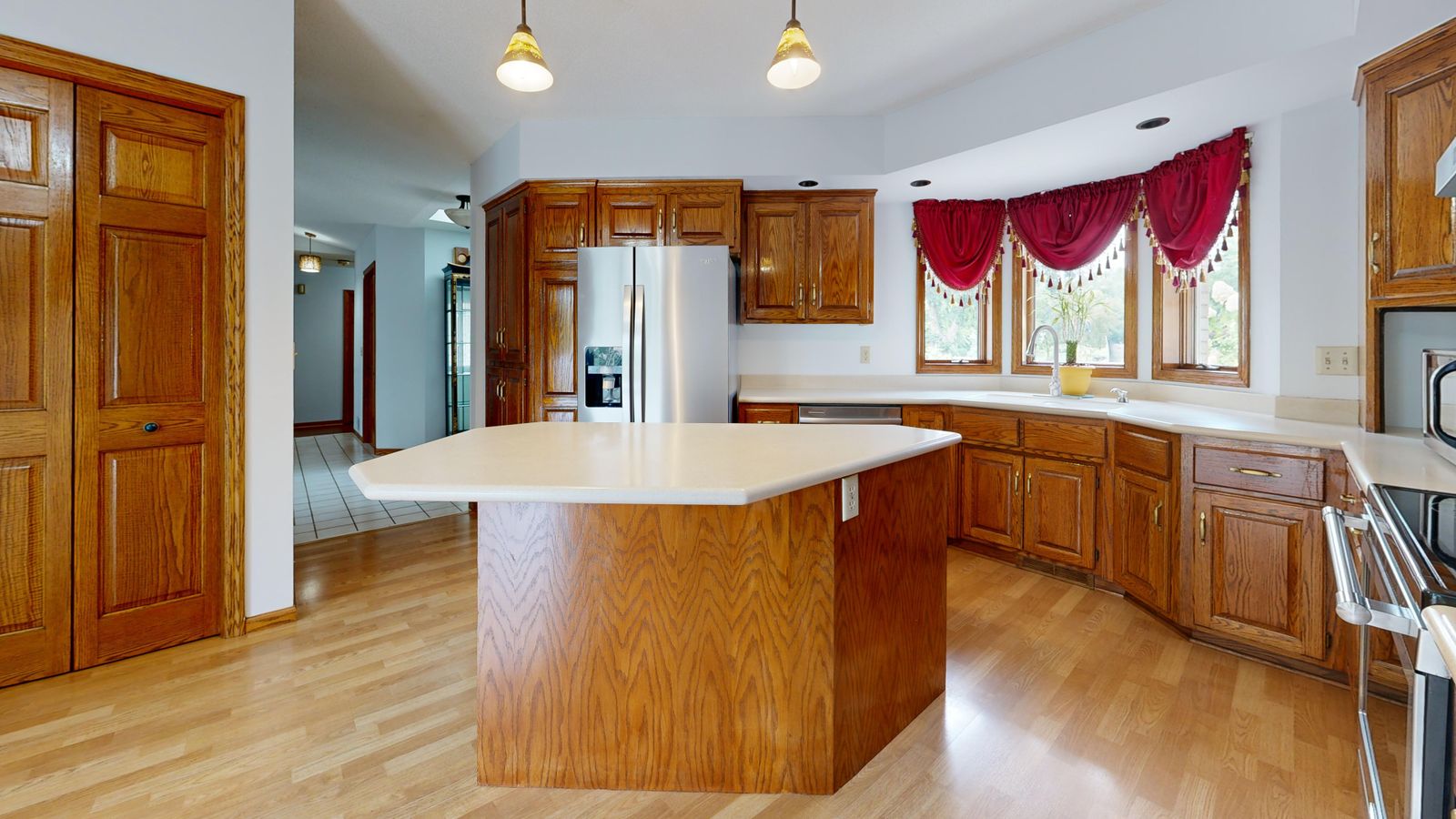 Bright kitchen with wood cabinets and center island